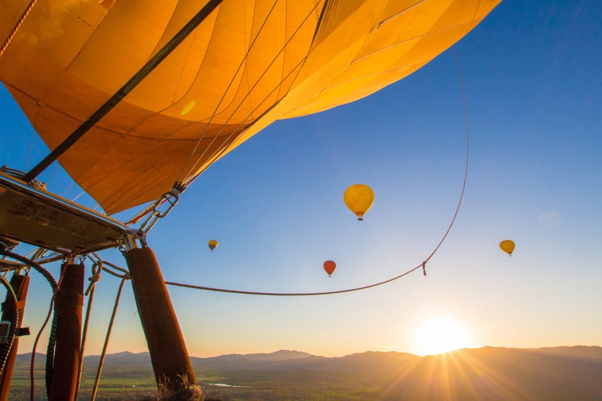 Sunrise Hot Air Balloon Flight near Cairns with Sparkling Wine and Optional Round Trip Transfer